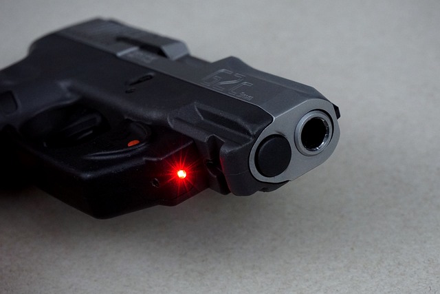 The gun with laser. 